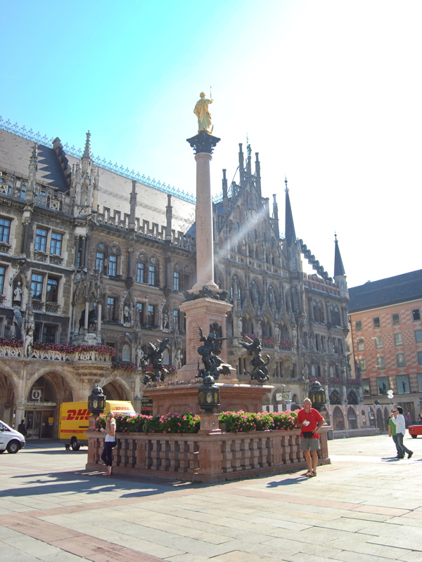 The historic Mariensäule (Mary's Column) set against the New Town Hall (Neues Rathaus) in Marienplatz, Munich
